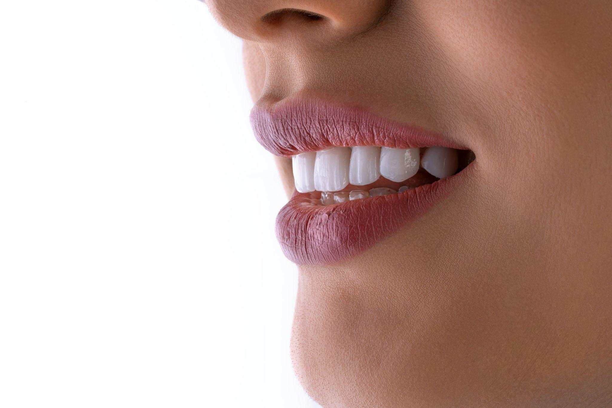 A close-up of a restored smile representing detailed dental restoration design in California.