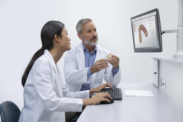 Dentist discussing dental laboratory solutions in California with a laboratory designer