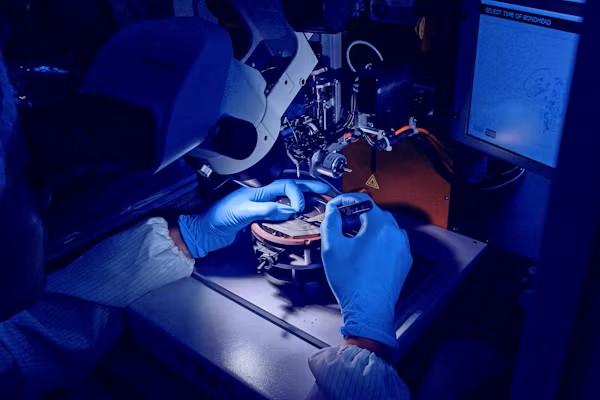 A technician working on dental prosthetics at an All-on-X dental lab in California