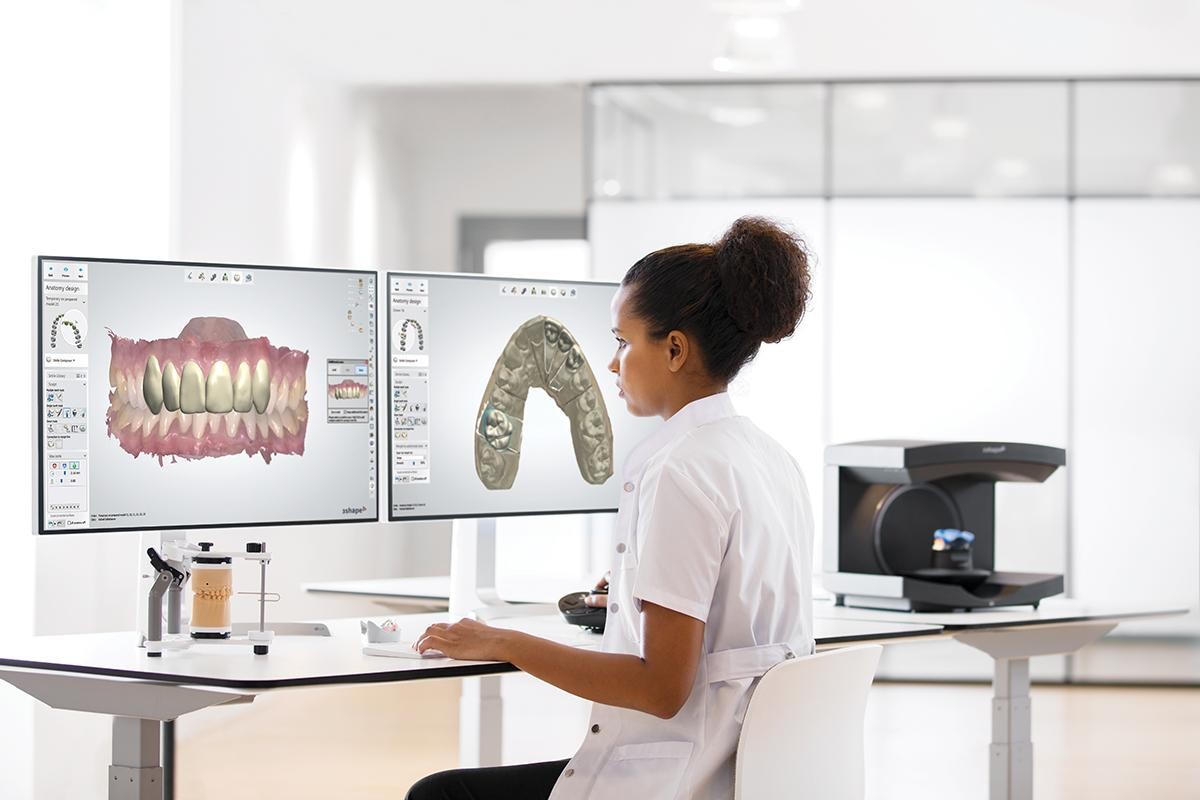 Dental technician using CAD/CAM technology for a full service dental lab in California.