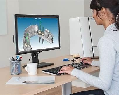 Dental lab training in California with a technician working on a digital CAD restoration